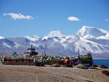 17 Seralung Gompa Chorten And Prayer Wheels With Lake Manasarovar And Gurla Mandhata Seralung Gompa chorten next to Lake Manasarovar with a row of prayer wheels and Gurla Mandhata.